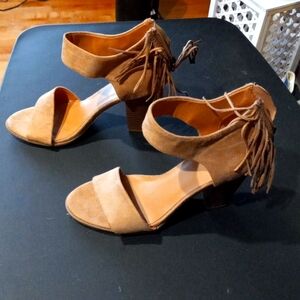 Suede taupe 3 1/2 inch heel. Never worn